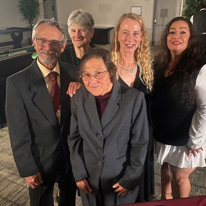 Barbara at VCBA Awards Ceremony surrounded by 4 other people.
